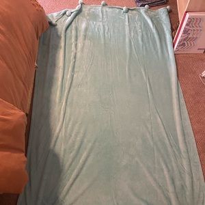 Teal Blanket with Pom Poms on the ends